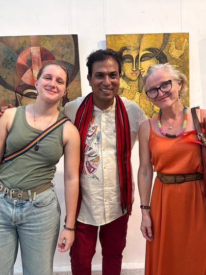 Posing with two international visitors at my exhibition in Colombo, sharing my art and culture.