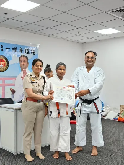 A young female student proudly receives her certificate. It is a joy to see the confidence in my students grow, especially when it is recognized by respected figures like DCP Tanu Sharma.