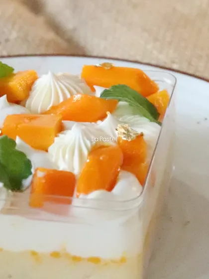 A side view of the Mango Tres Leches Tub, showing the distinct, delicious layers.