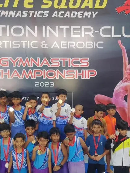 Our young male gymnasts proudly showing off their medals. We are committed to developing talent in both boys' and girls' gymnastics.