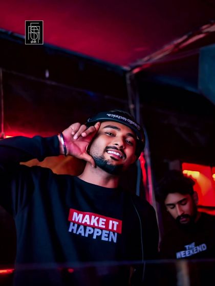 Rocking a "Make It Happen" shirt. That's my motto. I don't wait for the party to start; I make it happen.