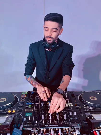 In the zone while performing at a private event in Abu Dhabi. I travel globally for gigs and love the challenge of playing for new crowds and in unique international locations, always bringing my signature energy.