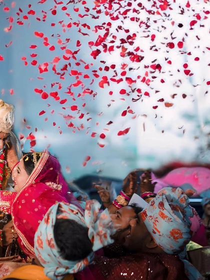A shower of rose petals rains down on the couple, a moment of pure celebration and blessing. I use creative angles to capture the grandeur and joy of your wedding day.