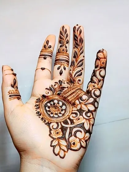 A delicate cutwork design on the palm, showing how the technique can be used for lighter, more intricate patterns.