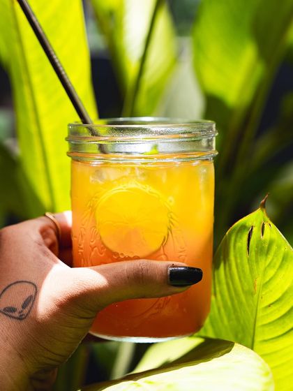 A close-up of our orange mocktail, showing its beautiful color.