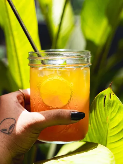 A close-up of our orange mocktail, showing its beautiful color.