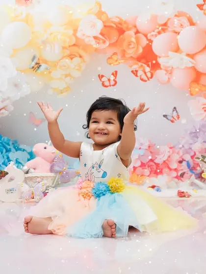 A whirlwind of color and happiness! This butterfly-themed first birthday shoot is filled with vibrant balloons and pure joy, showing how we can create a bright, cheerful, and magical setting for your little girl's big day.