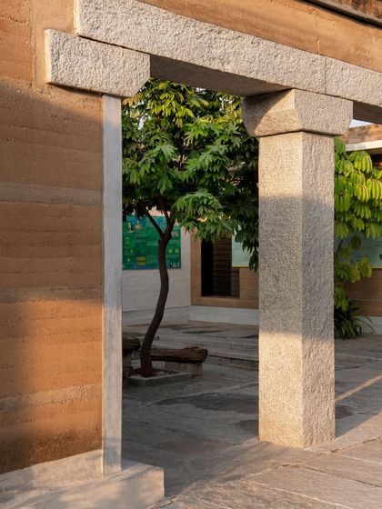 A detail of a stone doorway framing a view of a tree in the courtyard. This is an example of how I use architectural elements to connect the building with nature.