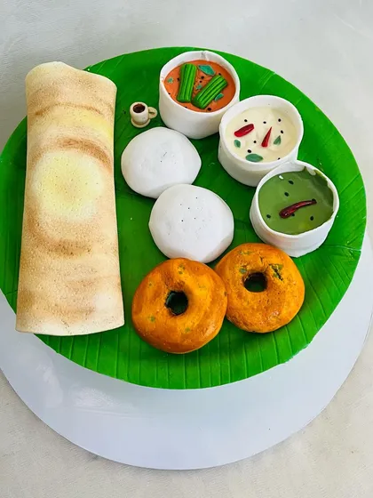 A taste of home, in cake form. This South Indian breakfast platter cake, complete with a fondant dosa, idli, vada, and chutneys, was a joy to create. It’s a perfect example of how any idea can become an edible masterpiece.
