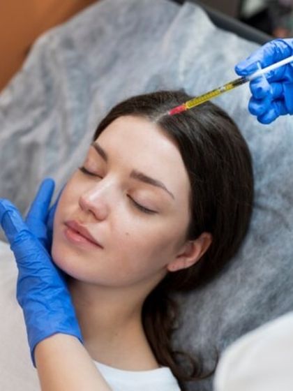 Here, a patient is receiving PRP injections for hair loss. This therapy enhances blood supply to the follicles and extends the hair's growth cycle, leading to thicker, healthier hair.