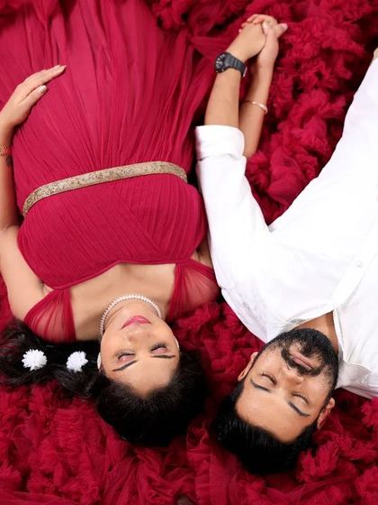 Another angle of the popular heart-shaped gown pose. This shot shows the couple holding hands, adding another layer of connection to this creative portrait.