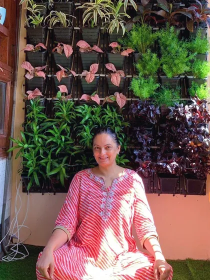 There's nothing better than seeing a happy client enjoy their new space. I created this compact living wall for a balcony, making a perfect little zen zone for morning tea or yoga. This is what "small space, big makeover" is all about.