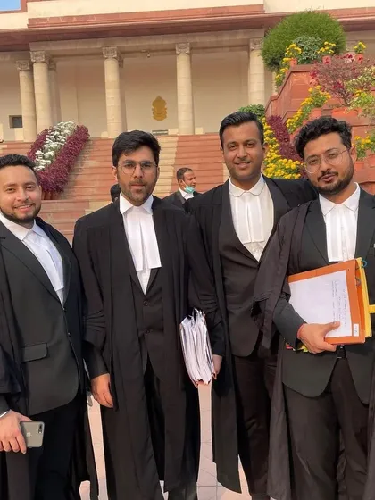 With my colleagues at the Supreme Court, ready for the day's proceedings. Our team ensures we are always prepared for every legal battle.