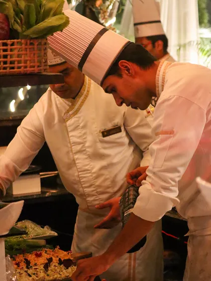 Teamwork in action. Our chefs collaborate to ensure every dish meets our exacting standards of quality and presentation.