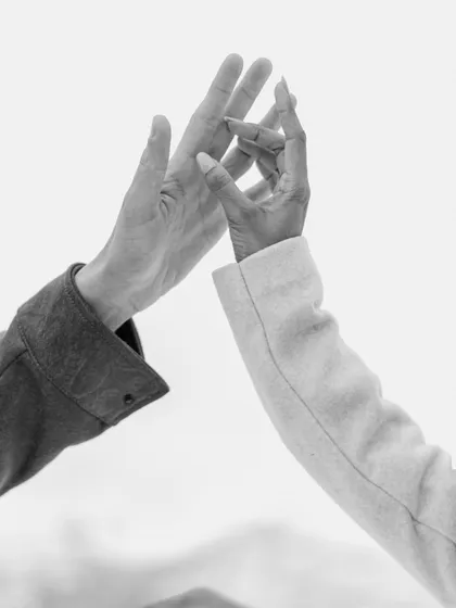 A simple touch, a world of meaning. This close-up of a couple's hands against the soft, snowy backdrop of Azerbaijan is a testament to the small gestures that define a great love story.