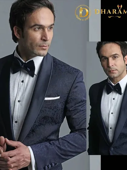 A model in a navy blue tuxedo with a subtle pattern. This is a great alternative to black, offering a touch of color while remaining formal and elegant.