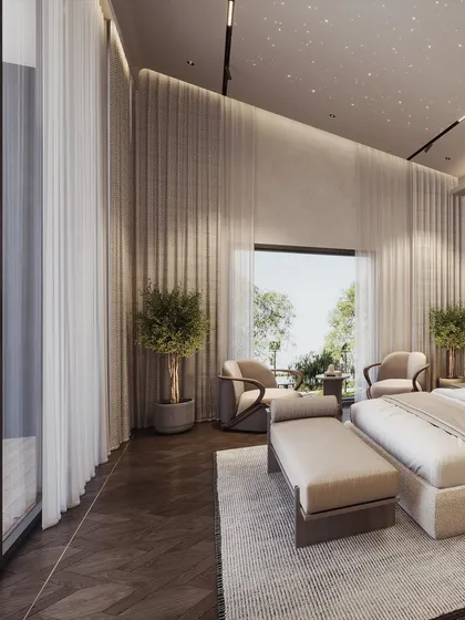 A wide shot showing the double-height curtains and the seating area by the window, creating a sense of grandeur and connection to the outdoors.