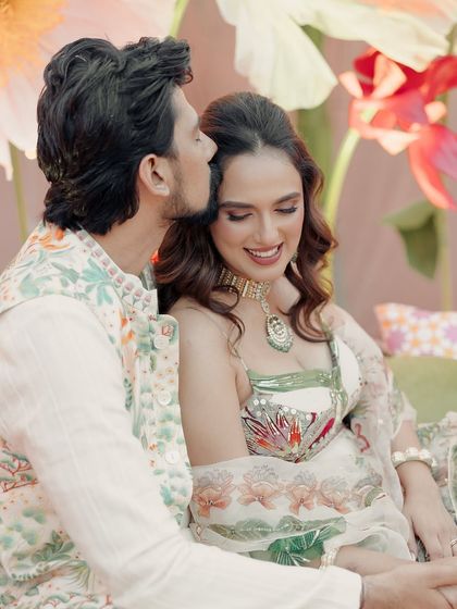 A close-up of Janvi's happy smile. Her radiant makeup highlights her joy, making her the glowing center of her Mehndi celebration.