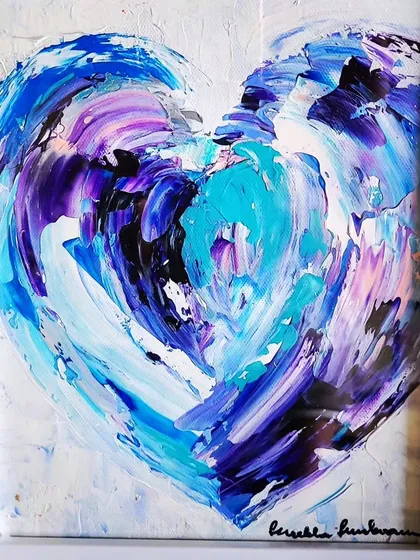 This piece is a pure expression of love, created with thick, textured acrylics and a palette knife. The layers of blue, purple, and white swirl together, capturing the energy and movement of deep emotion. It's a perfect example of my signature heart paintings, designed to bring a vibrant, soulful touch to any space.