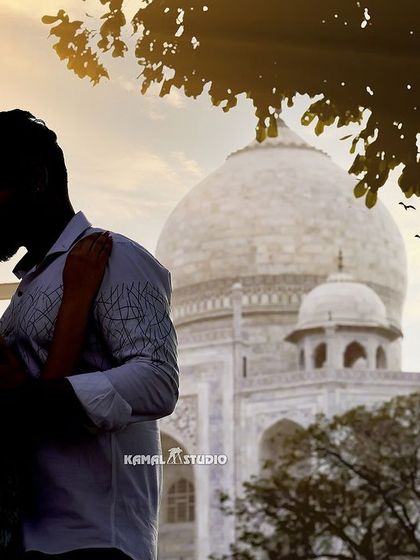 A silhouette of a couple against the golden hour glow at the Taj Mahal. This technique creates a dramatic and emotional image, focusing entirely on your connection.