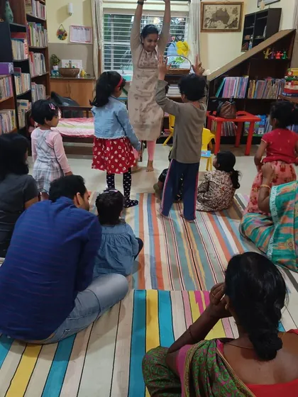 An action shot showing how we incorporate movement and play even during craft time.