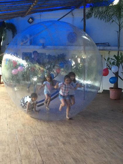 Our Rolling Balls can also be used indoors on a hard surface. Here you can see several children enjoying the challenge of coordinating their movements to make the giant ball roll.