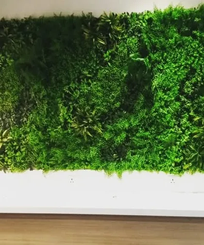 A simple but effective artificial vertical garden installed on a wall in a Cyber City office. Even a small green panel can significantly enhance the ambiance of a workspace.