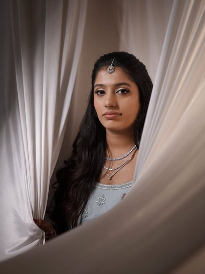 A creative, moody shot of the bride's reception look. The makeup is designed to look great in all types of lighting, from bright and airy to dark and dramatic.