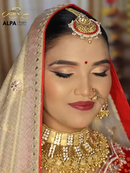 Eyes closed, this shot emphasizes the clean eyeliner work and the soft contouring that gives the face a sculpted, elegant appearance.