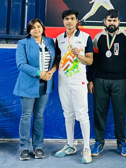 A senior sabre gold medalist from the 2023-24 Delhi State Championship, pictured with his coach. We train athletes across all age categories, from junior to senior.