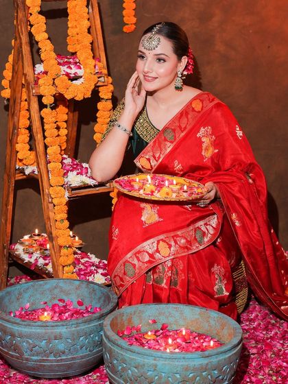 An entire Diwali-themed shoot featuring our red Banarasi saree. This series shows a complete concept, from decor to final look, providing rich inspiration for festive content.