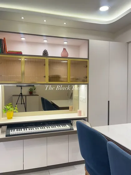 A cleverly designed multi-purpose unit that includes a hidden keyboard tray. This piece of furniture serves as a display cabinet and a compact workstation, making it a perfect example of our space-saving solutions.