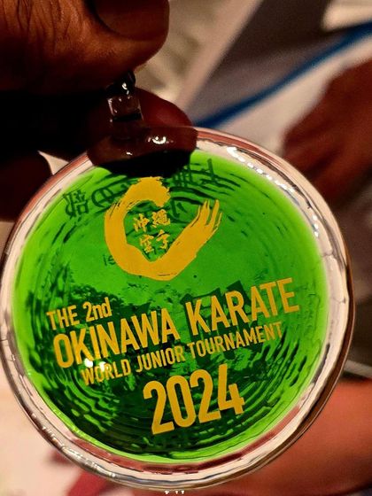 Another look at the beautifully crafted medal from the 2024 Okinawa Junior Tournament. It is a symbol of a world class event and a prestigious honor for our students.