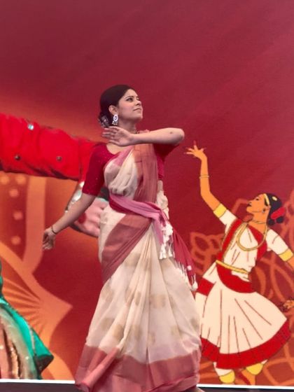 A still from my performance at the Vivekananda Education Society's College. The backdrop and stage setup added a wonderful visual element to the event.