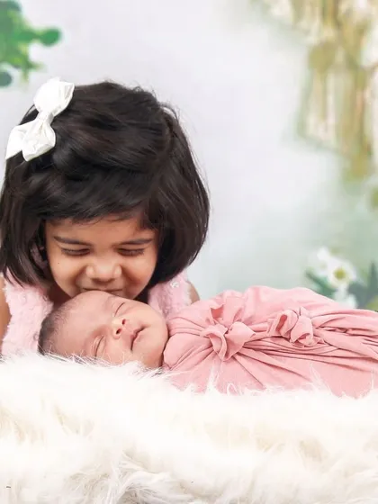 A sweet kiss from a big sister. Capturing the bond between siblings is one of my favorite parts of a newborn family session.