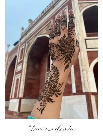 This client chose a beautiful floral and paisley design, pictured here against the backdrop of Humayun's Tomb in Delhi. It's a perfect blend of art and heritage.