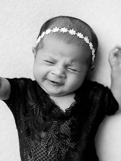 Another expressive cry, captured in dramatic black and white. These photos tell a story of the baby's first few weeks of life.