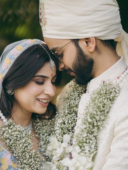An intimate close up from Shikha's phera ceremony. Her makeup is soft and minimal, with a focus on flawless skin and natural tones.