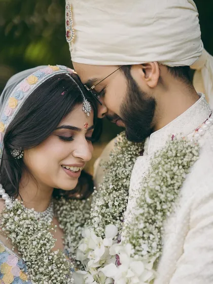 An intimate close up from Shikha's phera ceremony. Her makeup is soft and minimal, with a focus on flawless skin and natural tones.