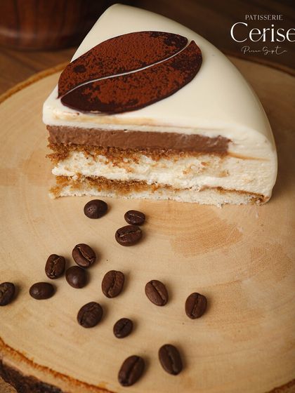 A slice of my Tiramisu, showing the slow embrace of coffee and Baileys, layered with depth and warmth.