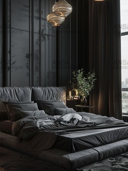 A closer look at the dramatic all-black bedroom. The layered bedding, plush rug, and textured wall panels show how a single color can be used to create a rich and complex design when different textures are employed.
