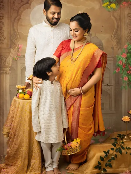 A heartwarming family moment during a traditional maternity shoot. The older son looks up at his mother, sharing in the excitement for the new baby, all within a beautifully painted scene.