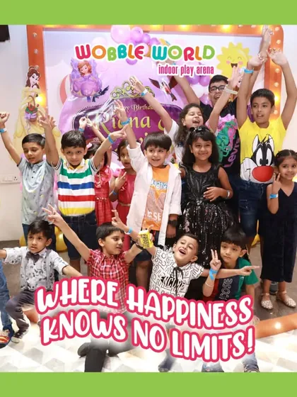 A whole group of kids cheering and celebrating a birthday. The energy and happiness in this photo is what Wobble World is all about.