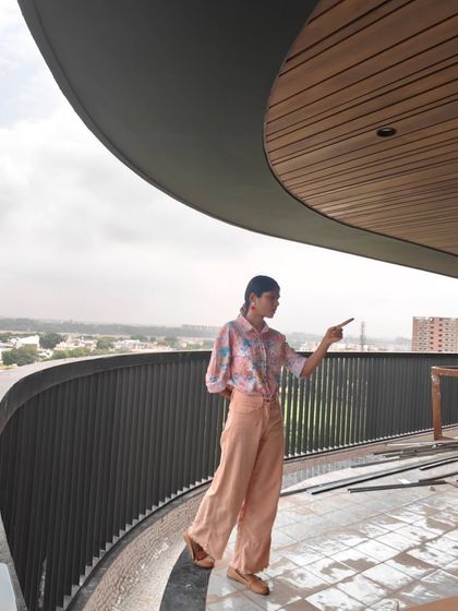 Pointing out the potential area for a mural during a site visit. This is part of the visual brainstorming and discussion with the client.