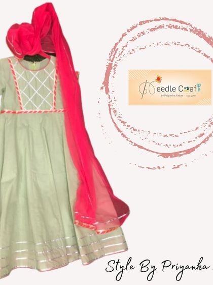 This light green Anarkali suit with a bright pink dupatta is a lovely combination of soft and vibrant colors. The gota patti work on the yoke adds a touch of traditional craftsmanship.