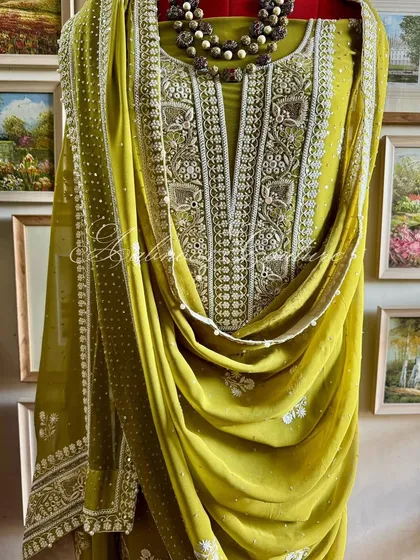 A three-quarter view of the suit, demonstrating how the dupatta can be styled for a regal look.