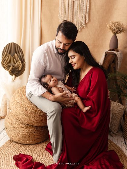 A beautiful family session in my rustic, boho-themed setup. The warm tones and natural textures create a cozy and inviting portrait.