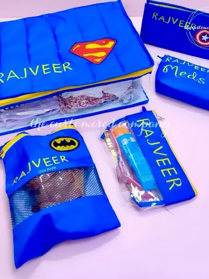 Making memories, one tiny adventure at a time! This personalized superhero-themed travel organizer set for kids includes pouches for clothes, medicine, and other essentials.