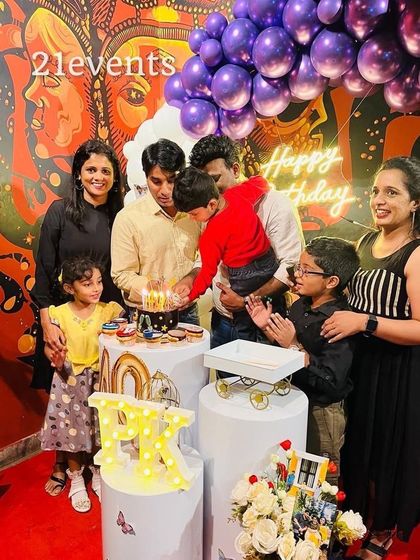 The birthday person and guests celebrating a 40th birthday.