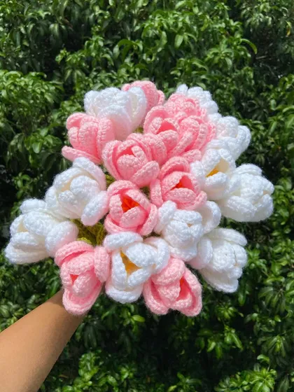 A full and beautiful bouquet combining pink and white open tulips.